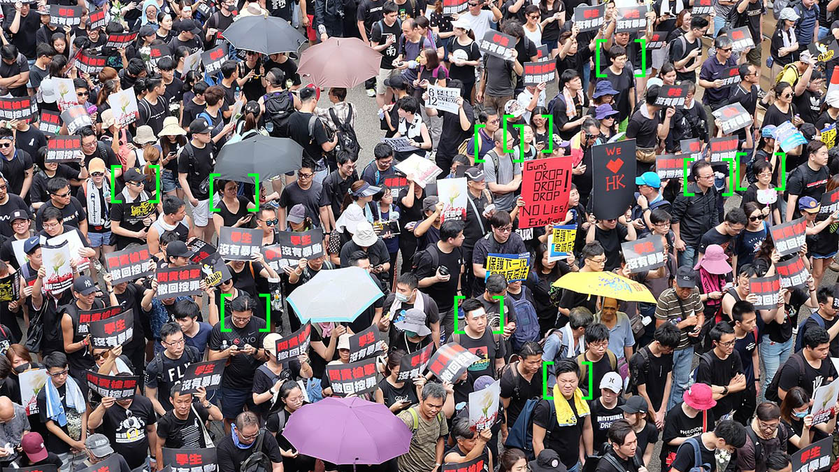Hong Kong protest, modified with symbols that represent facial recognition technology