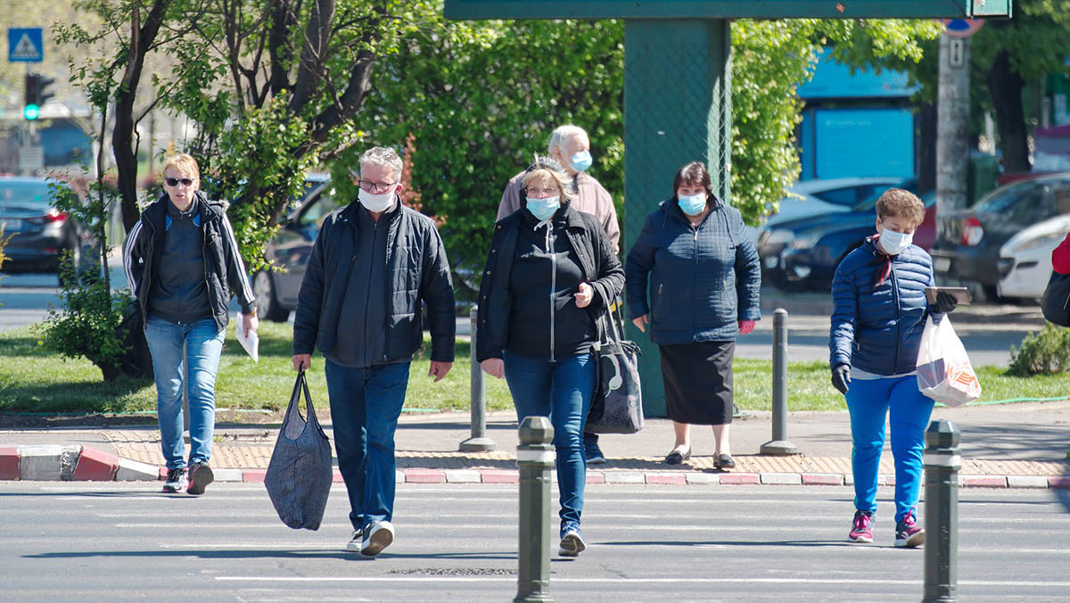 People wearing face masks as they head to work