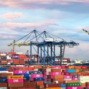 Cargo backlog, shipping containers stacked up at port