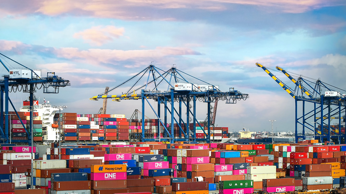 Cargo backlog, shipping containers stacked up at port