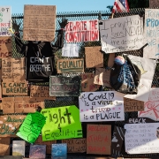 Protest signage at the White House fence