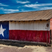 Barn painted with Texas flag design