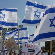 Pro-Israel protestors carry Israel national flags