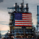 American flag hanging from an oil refinery in Carson, California