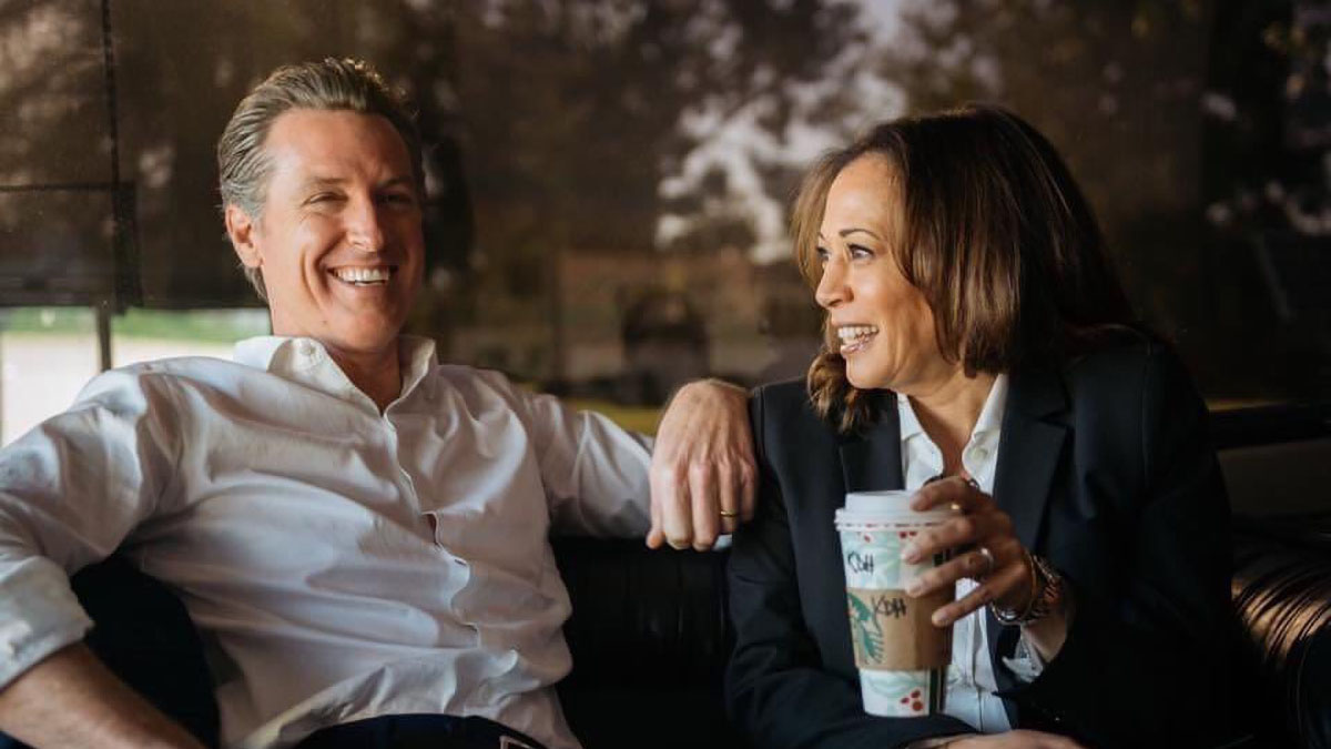 Gavin Newsom and Kamala Harris share a laugh.