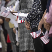 Immigrants become U.S. citizens in a naturalization ceremony