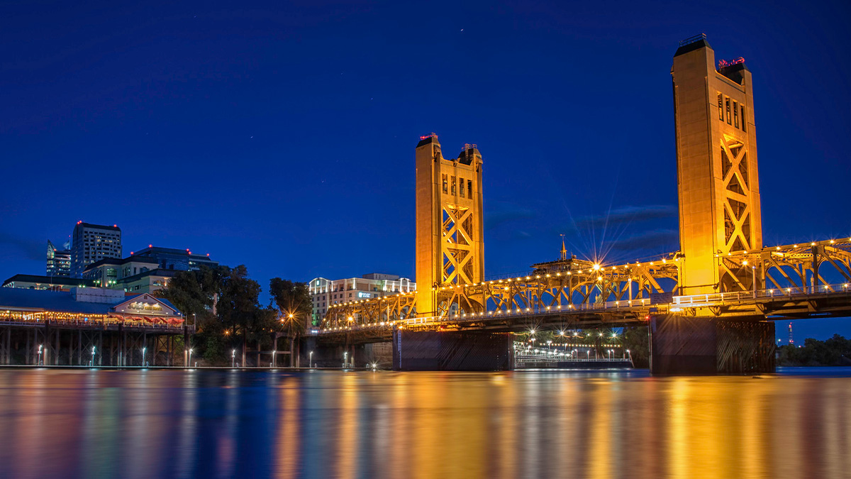 The golden Tower Bridge in Sacramento symbolizing the once golden state.