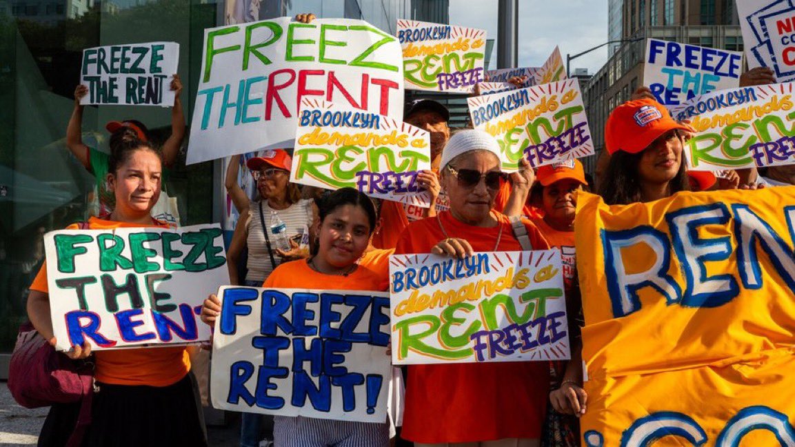 New Yorkers celebrate the passage of a bill to freeze rents.